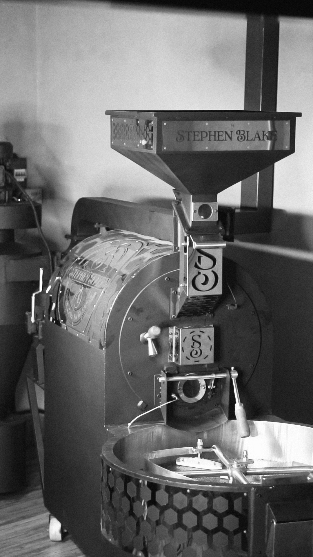 Black-and-white photograph of the Stephen Blake coffee roaster and cooling tray
